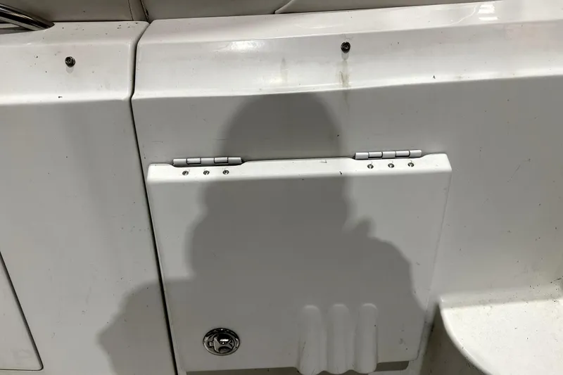 Slide: The Image of Hinged compartment on 2002 Four Winns 378 Vista boat, showing shadow and latch detail. - 65