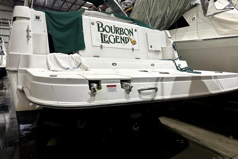 Slide: The Image of 2002 Four Winns 378 Vista boat named "Bourbon Legend" in a marina setting. - 7