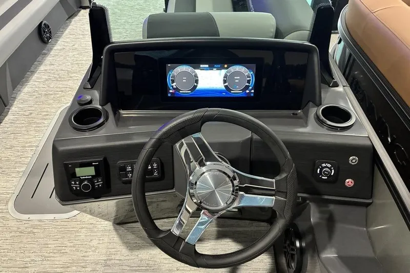 Slide: The Image of 2026 Bennington S Swingback 23 SSB dashboard with modern steering and digital display. - 4