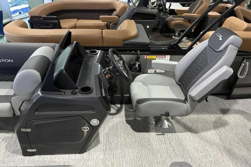 Slide: The Image of 2026 Bennington S Swingback 23 SSB boat interior with modern helm and seating. - 7