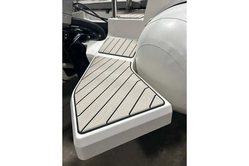 Slide: The Image of 2025 Zodiac Medline 6.8 boat interior with gray seating and modern design. - 10