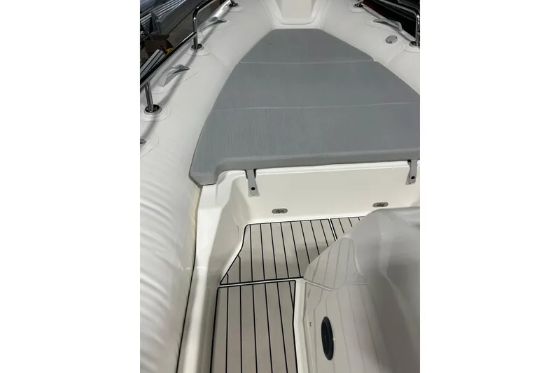 Slide: The Image of 2025 Zodiac Medline 6.8 boat interior with gray seating and sleek deck design. - 11