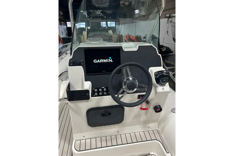 Slide: The Image of 2025 Zodiac Medline 6.8 boat dashboard with Garmin navigation system. - 18