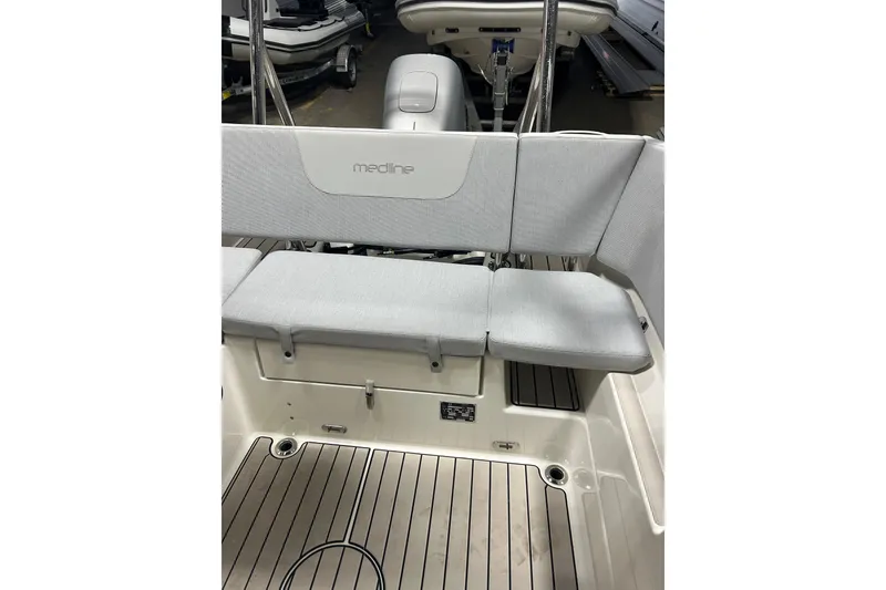 Slide: The Image of 2025 Zodiac Medline 6.8 boat side view with logo and branding. - 6