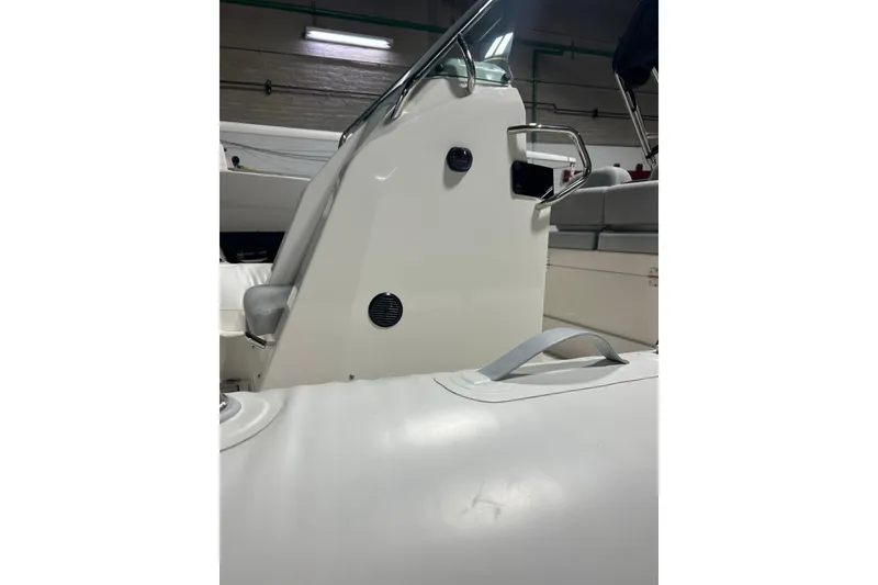 Slide: The Image of 2025 Zodiac Medline 6.8 boat interior with steering console and seating. - 8