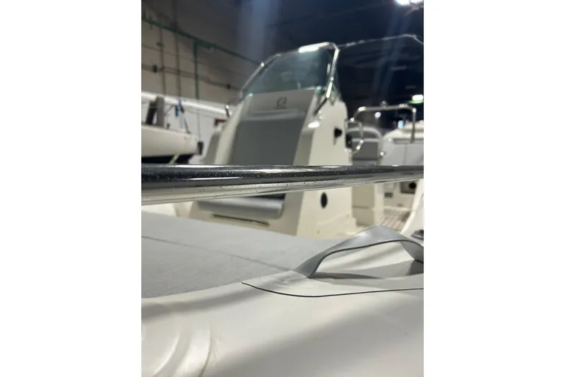 Slide: The Image of 2025 Zodiac Medline 6.8 boat on trailer in indoor storage. - 9