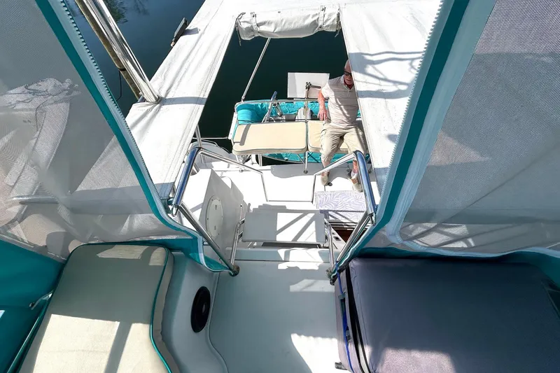 Slide: The Image of 2004 PDQ 34 Power Catamaran interior with seating and canopy, viewed from above. - 23