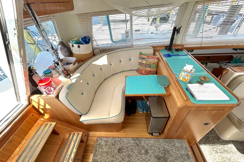Slide: The Image of Interior of 2004 PDQ 34 Power Catamaran with cozy seating and nautical decor. - 30