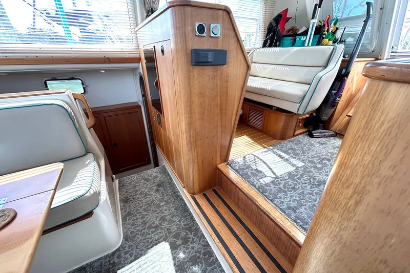 Slide: The Image of Interior of 2004 PDQ 34 Power Catamaran with wood accents and seating area. - 39