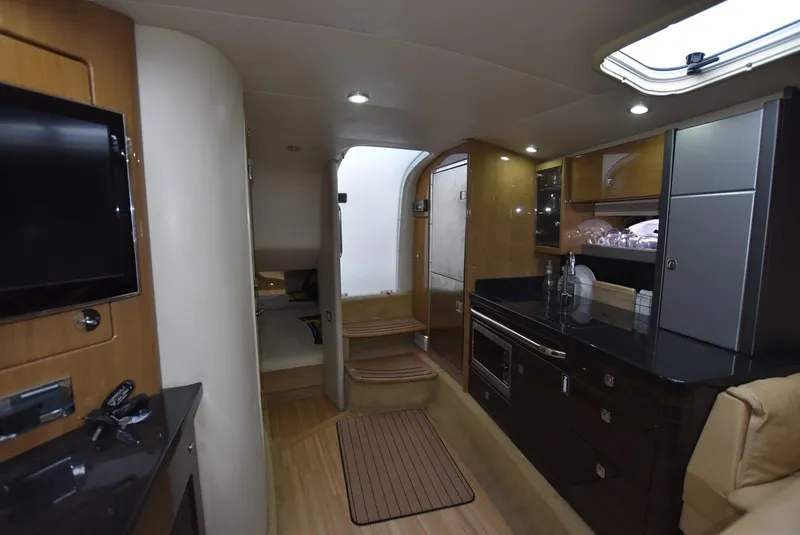 Slide: The Image of Interior of 2011 Formula 400ss yacht with modern kitchen and cozy living area. - 15