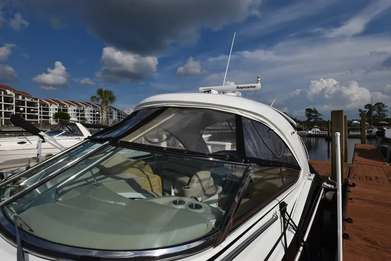 Slide: The Image of 2011 Formula 400ss boat docked at a marina under a partly cloudy sky. - 3