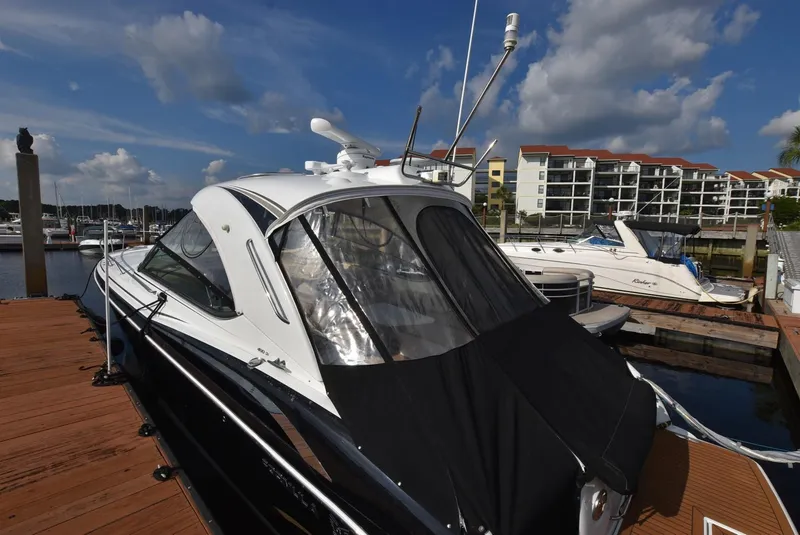 Slide: The Image of 2011 Formula 400ss boat docked at marina with waterfront condos in background. - 4