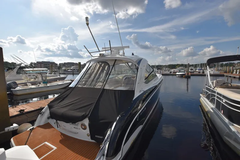 Slide: The Image of 2011 Formula 400ss yacht docked at a marina on a sunny day. - 5