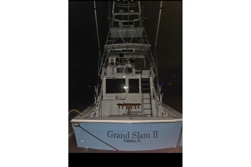 Slide: The Image of 1982 Viking 46 Convertible boat, "Grand Slam II," docked at night in Palatka, FL. - 5