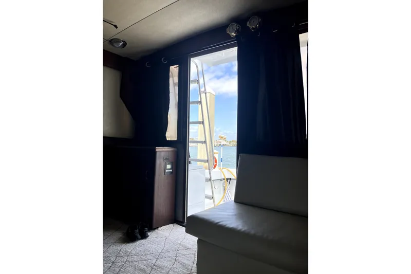 Slide: The Image of Interior view of 1982 Viking 46 Convertible yacht with open door to deck. - 9