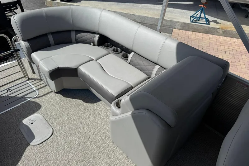 Slide: The Image of 2022 Bennington 25 LFB boat interior with gray seating and cup holders. - 24