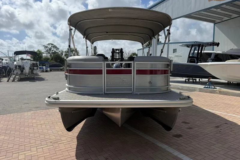 Slide: The Image of 2022 Bennington 25 LFB pontoon boat displayed outdoors on a sunny day. - 6