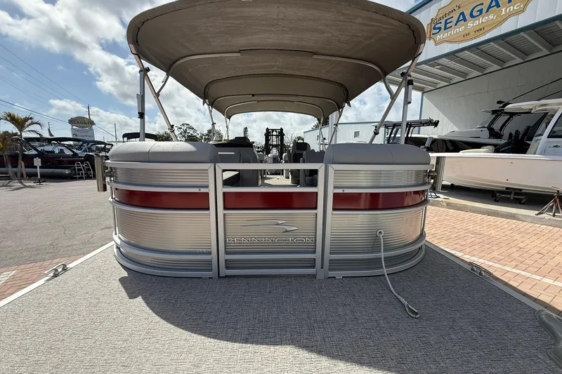 Slide: The Image of 2022 Bennington 25 LFB pontoon boat at a marine sales dealership. - 7