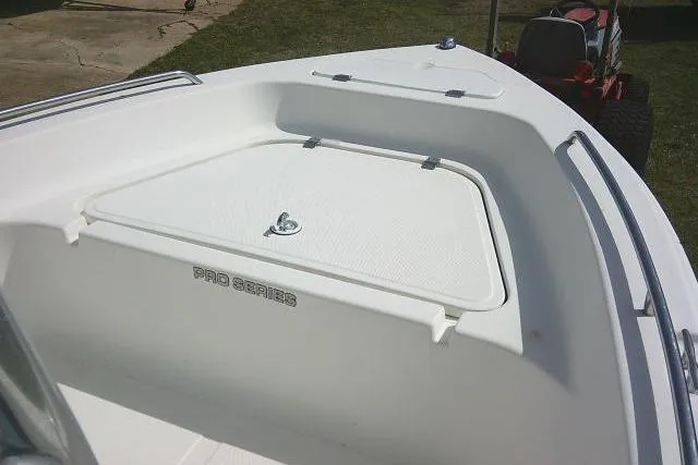 Slide: The Image of 2010 Sea Fox 187 Center Console boat deck with storage compartment, Pro Series branding. - 10