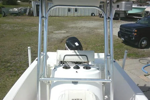Slide: The Image of 2010 Sea Fox 187 Center Console boat with outboard motor, parked outdoors. - 12
