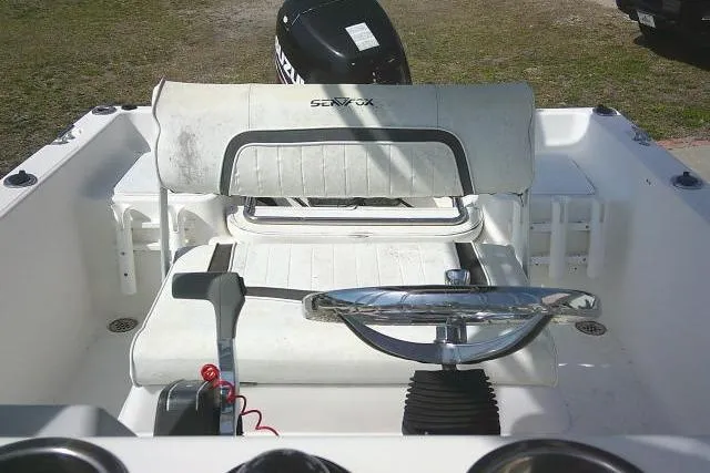 Slide: The Image of 2010 Sea Fox 187 Center Console boat interior with steering wheel and seating. - 13