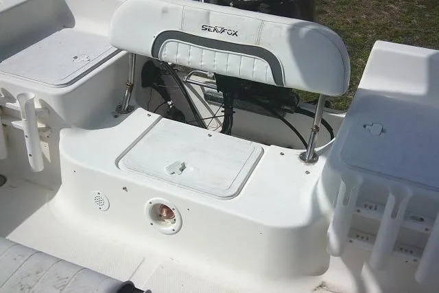 Slide: The Image of 2010 Sea Fox 187 Center Console boat interior with seating and storage compartments. - 16