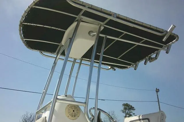 Slide: The Image of 2010 Sea Fox 187 Center Console boat with T-top under clear blue sky. - 18