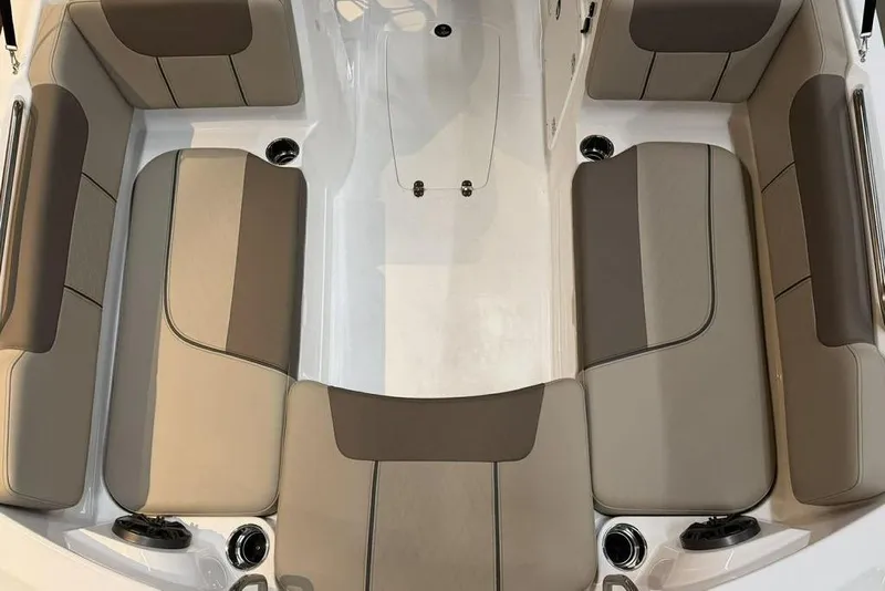 Slide: The Image of 2026 Tahoe 2150 boat interior with beige and brown cushioned seating. - 12