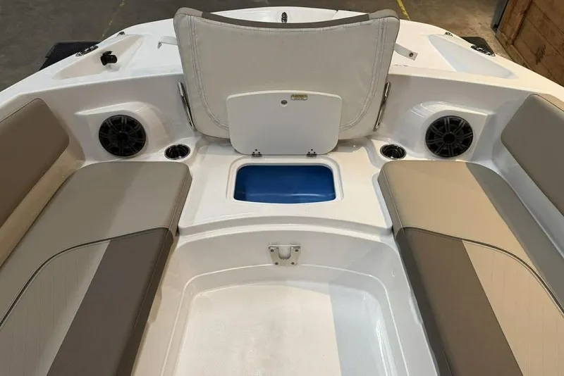 Slide: The Image of 2026 Tahoe 2150 boat interior with seating, speakers, and storage compartment. - 13
