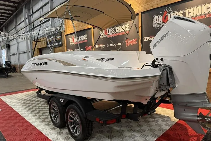 Slide: The Image of 2026 Tahoe 2150 boat with Mercury engine on display in showroom. - 5