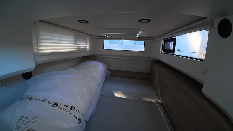 Slide: The Image of Interior of a 2027 Saxdor 400 GTC featuring a bed and windows. - 11