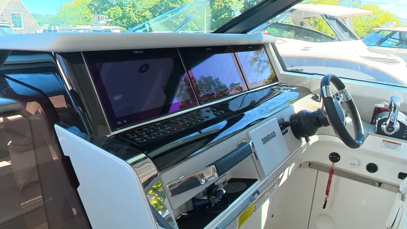 Slide: The Image of The image shows the cockpit of a Saxdor 400 GTC with modern instruments and a sleek steering wheel. - 24