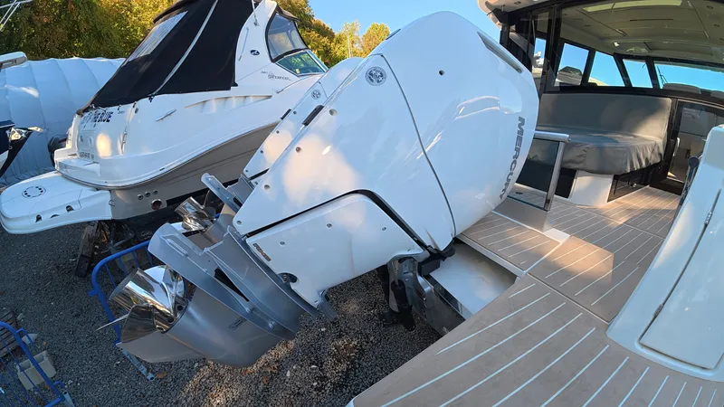 Slide: The Image of A 2027 Saxdor 400 GTC with a large outboard motor. It is on a dry dock. - 5