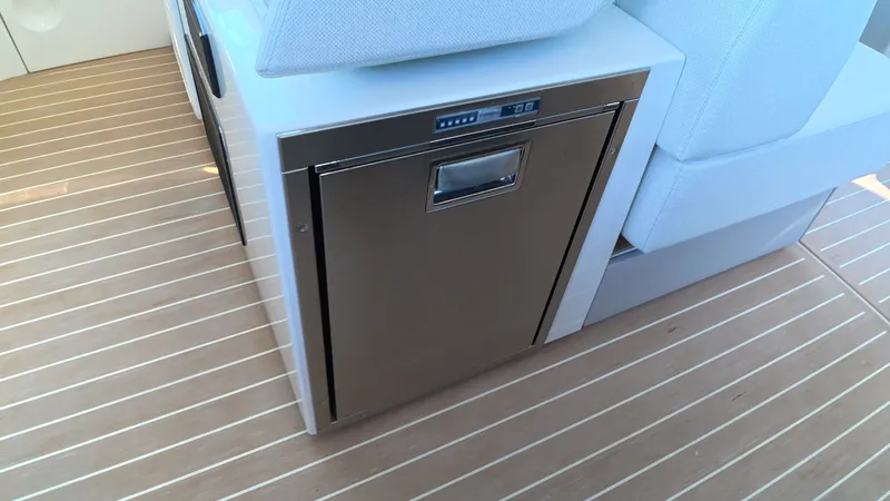 Slide: The Image of A modern refrigerator is integrated into the floor of a 2027 Saxdor 400 GTC. - 21