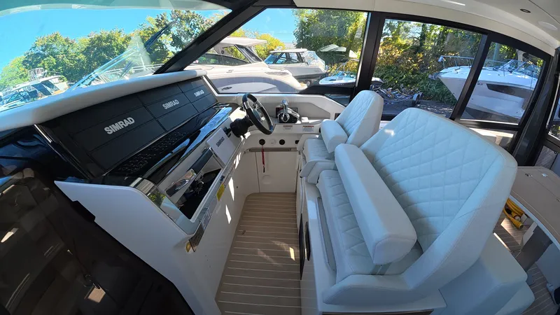 Slide: The Image of The image shows the cockpit of a Saxdor 400 GTC with modern instruments and white leather seats. - 23