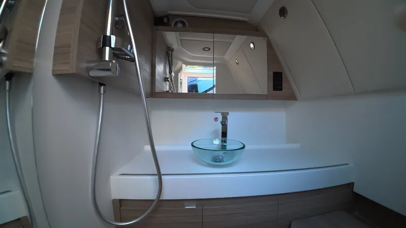 Slide: The Image of Modern bathroom with glass sink and wood accents in a boat. - 34