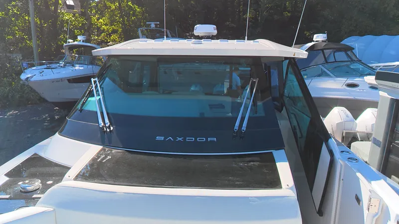 Slide: The Image of The image shows a Saxdor 400 GTC boat from 2027 with a modern design. - 44