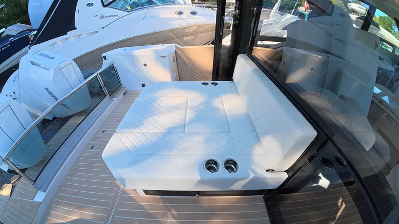 Slide: The Image of The image shows the deck of a 2027 Saxdor 400 GTC with a white cushioned bench. - 9