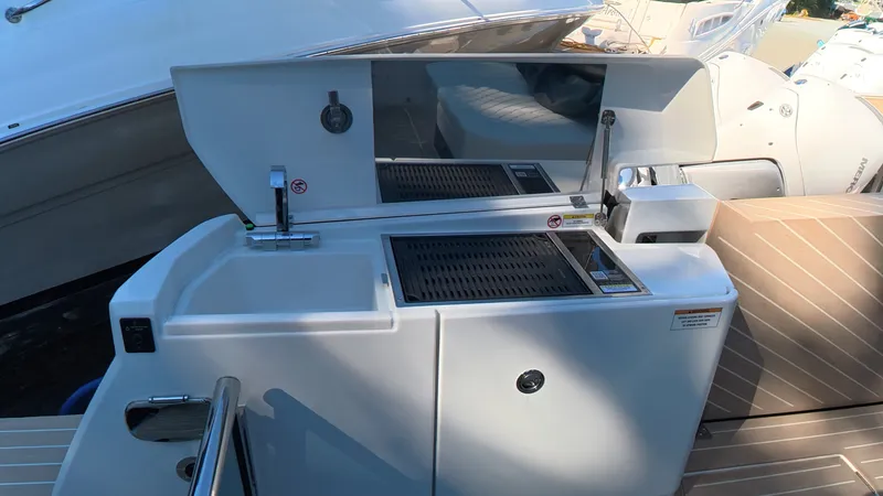 Slide: The Image of The 2027 Saxdor 400 GTC features a modern outdoor kitchen with a sink and grill. - 7