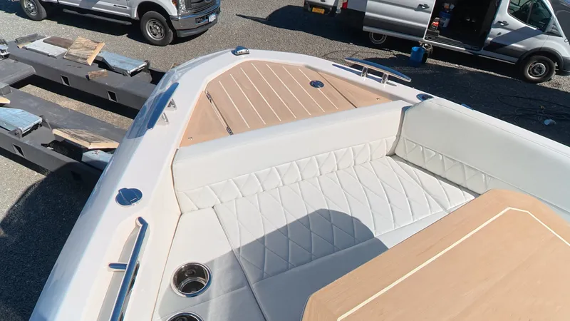 Slide: The Image of The image shows the bow of a Saxdor 400 GTC with sleek upholstery and wood accents. - 43