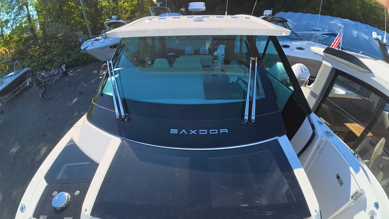 Slide: The Image of The image shows a Saxdor 400 GTC boat from 2027 with a modern design. - 49