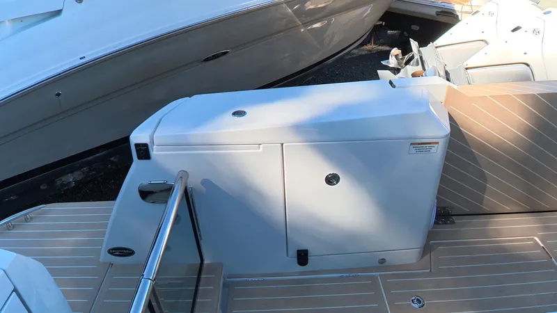 Slide: The Image of The image shows the deck of a Saxdor 400 GTC with a white storage hatch. - 6