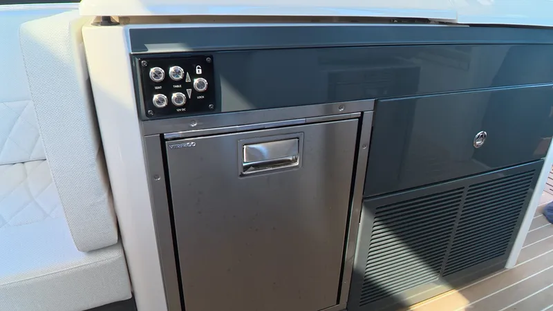 Slide: The Image of Galley area of the Saxdor 400 GTC with stainless steel fridge and control panel. - 19