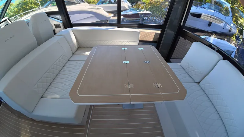 Slide: The Image of Interior of a Saxdor 400 GTC with elegant seating area and wooden table. - 15