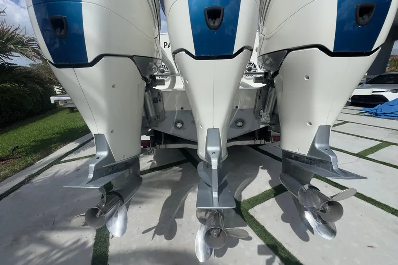 Slide: The Image of Triple outboard motors on a 2007 Intrepid 370 Center Console boat. - 15