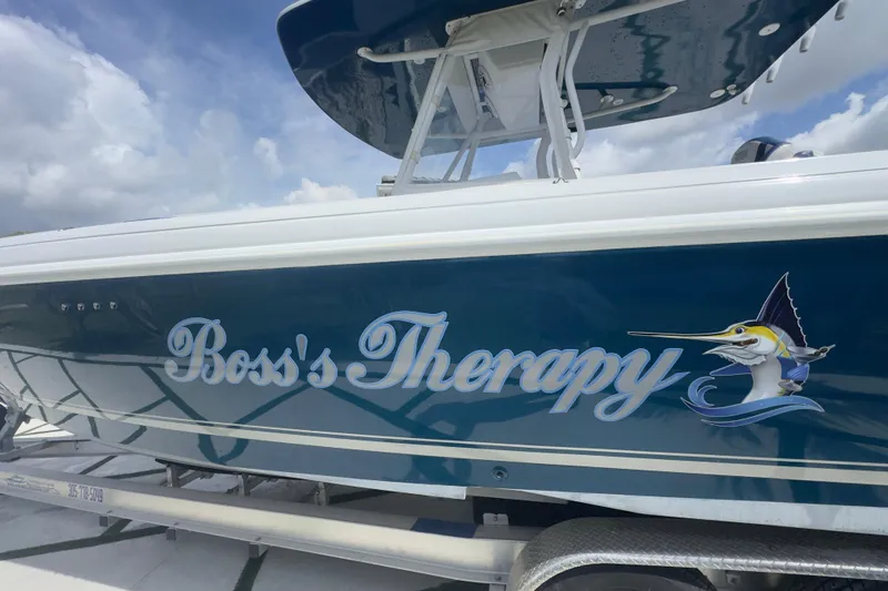 Slide: The Image of 2007 Intrepid 370 Center Console boat named "Boss's Therapy" with marlin graphic. - 21