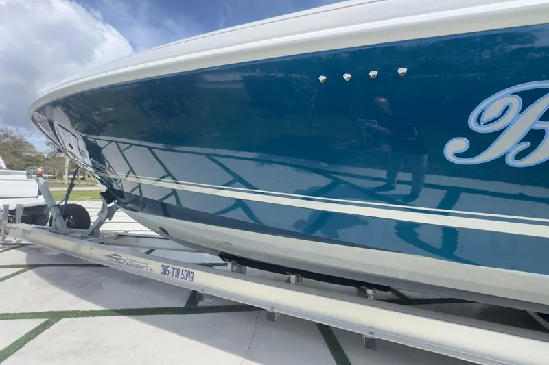 Slide: The Image of 2007 Intrepid 370 Center Console boat on trailer, blue hull, outdoor setting. - 22