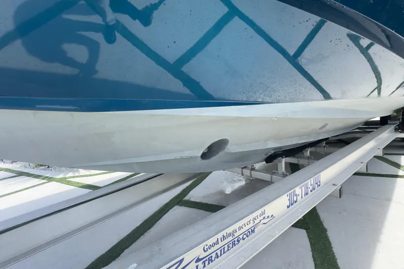 Slide: The Image of 2007 Intrepid 370 Center Console boat on trailer, showing hull detail. - 27