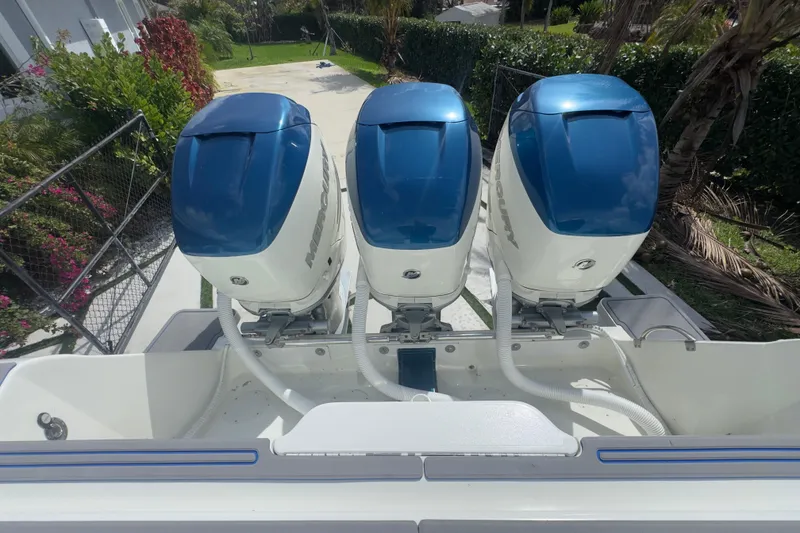 Slide: The Image of Triple Mercury outboard engines on a 2007 Intrepid 370 Center Console boat. - 32