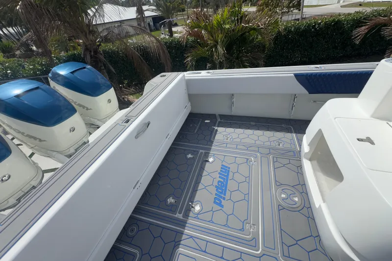 Slide: The Image of 2007 Intrepid 370 Center Console boat deck with Mercury engines and custom flooring. - 33